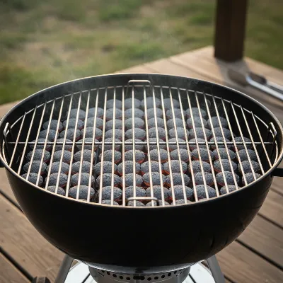 Uniform charcoal briquettes arranged for consistent, long-duration grilling
