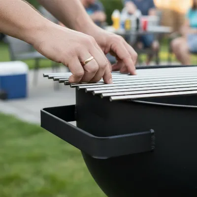 Inspecting the material and construction of a charcoal grill for durability and quality