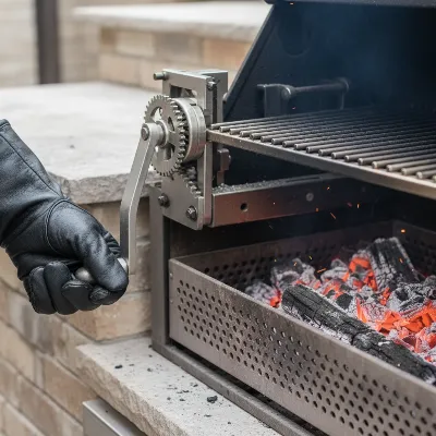 A close-up shot of an adjustable charcoal tray inside a built-in charcoal grill, with a hand demonstrating temperature control.
